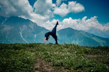 young-woman-doing-yoga-exercises-natural-environment_181624-29920
